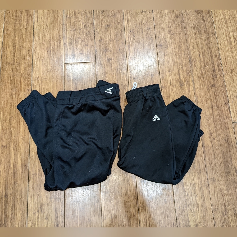 Two pairs of Girls black medium softball pants, Easton and Adidas